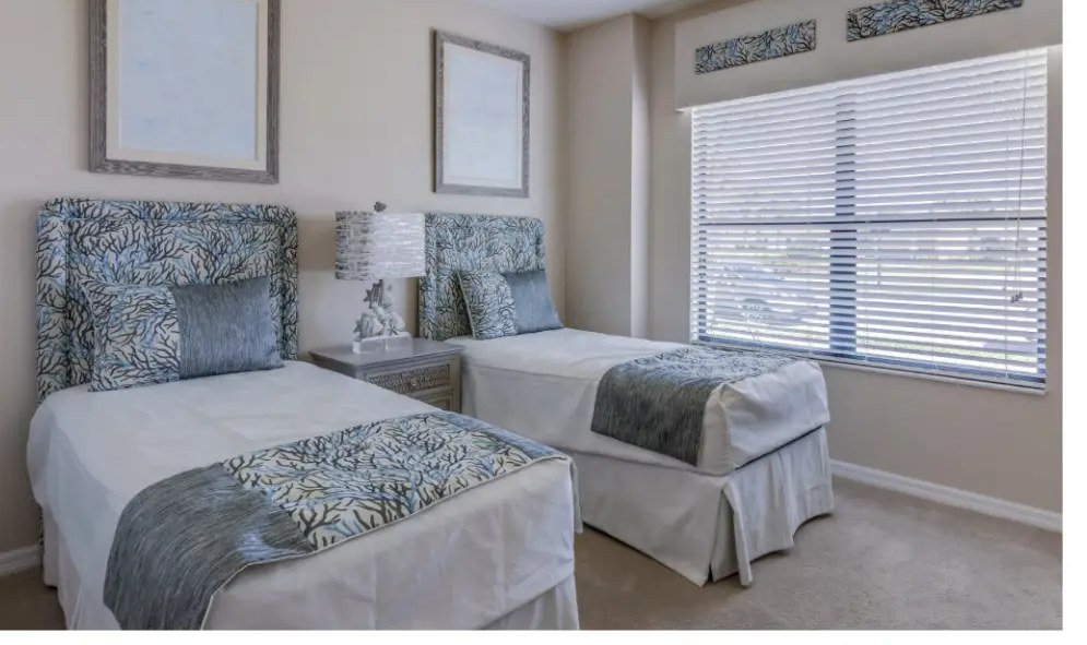 Clean, furnished bedroom with two beds